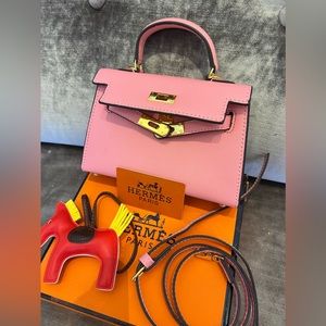 Mini Hermes Kelly handbag with strap and horse